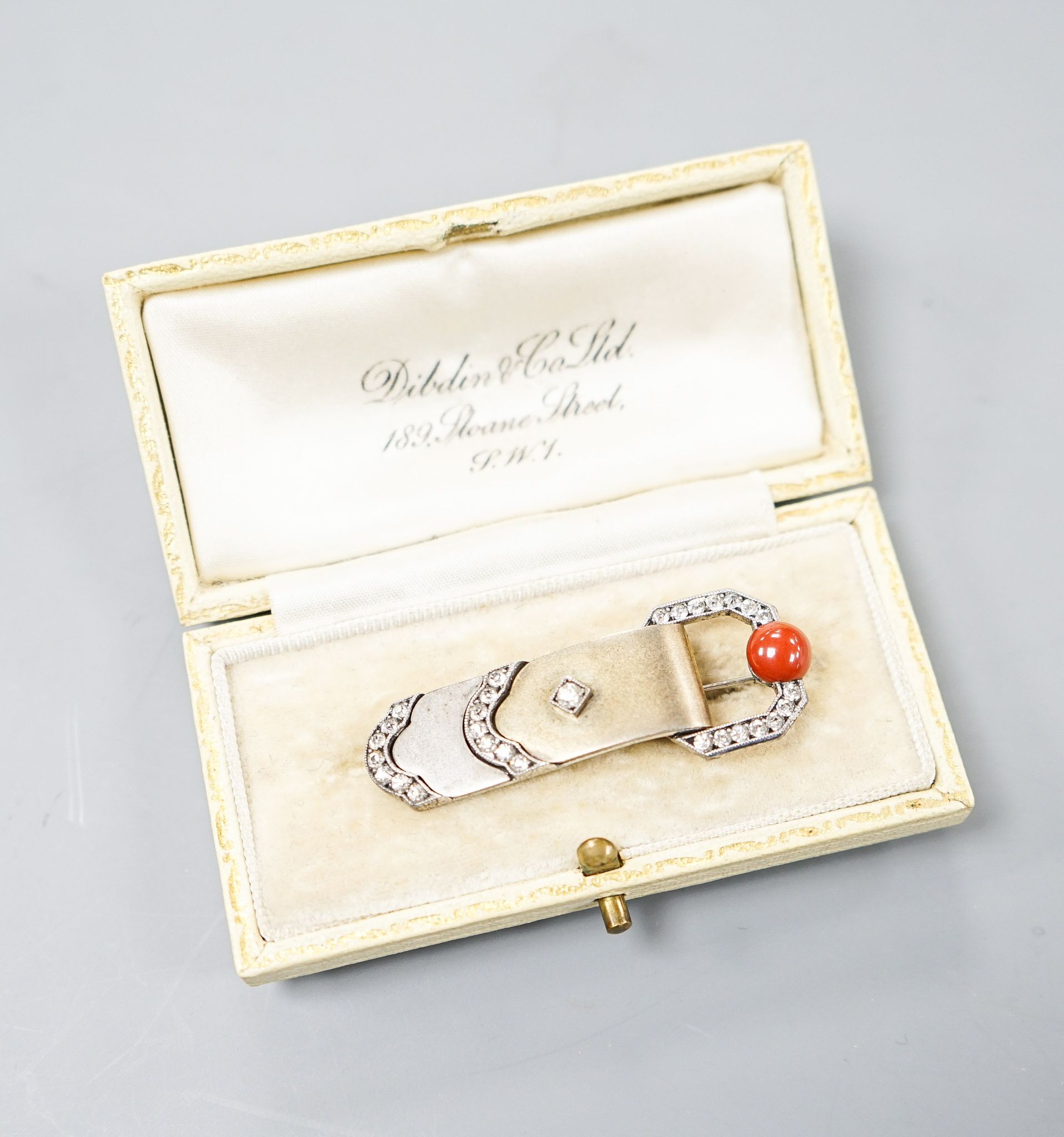 A German Art Deco 935 white metal, carnelian and white paste set clip brooch, 45mm, in Dibdin & Co leather box.